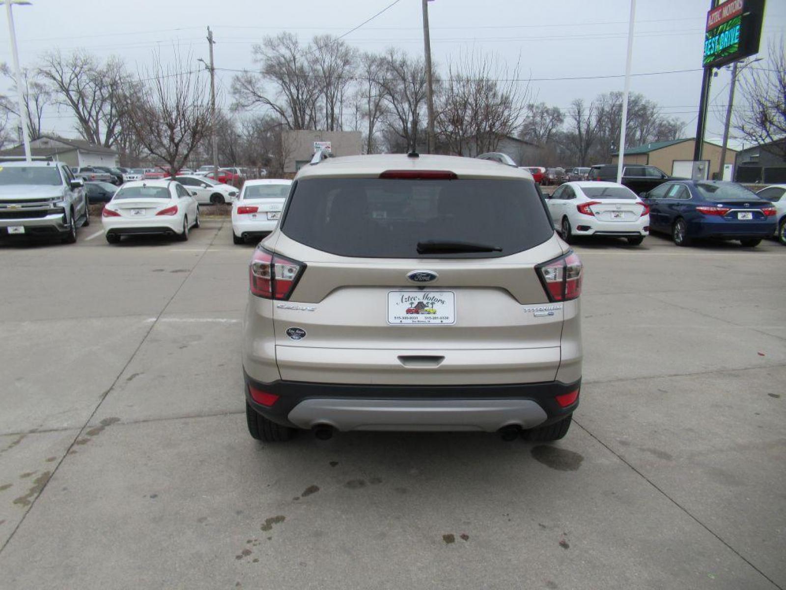 2017 GOLD FORD ESCAPE TITANIUM (1FMCU9JD4HU) with an 1.5L engine, Automatic transmission, located at 908 SE 14th Street, Des Moines, IA, 50317, (515) 281-0330, 41.580303, -93.597046 - Photo #5