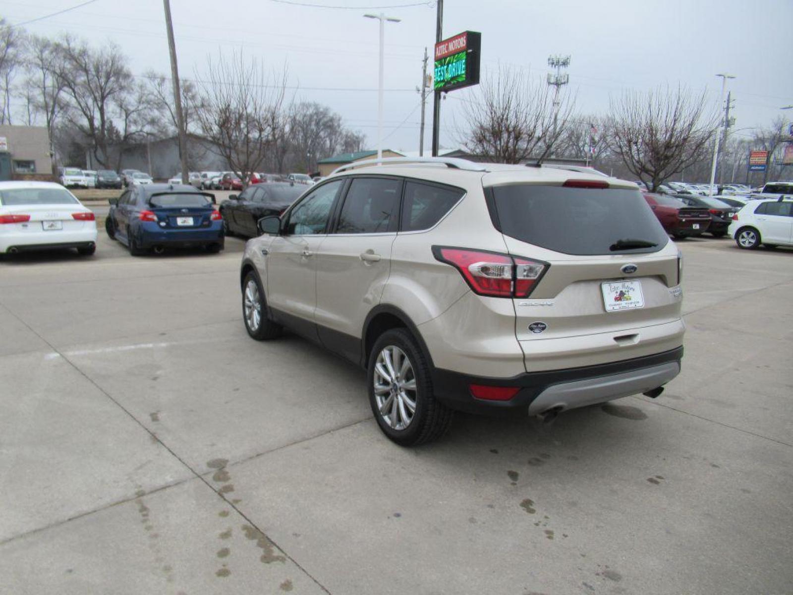 2017 GOLD FORD ESCAPE TITANIUM (1FMCU9JD4HU) with an 1.5L engine, Automatic transmission, located at 908 SE 14th Street, Des Moines, IA, 50317, (515) 281-0330, 41.580303, -93.597046 - Photo #6