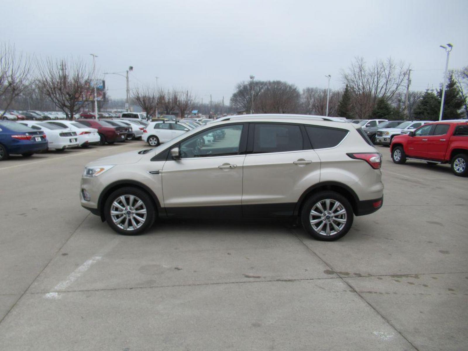 2017 GOLD FORD ESCAPE TITANIUM (1FMCU9JD4HU) with an 1.5L engine, Automatic transmission, located at 908 SE 14th Street, Des Moines, IA, 50317, (515) 281-0330, 41.580303, -93.597046 - Photo #7