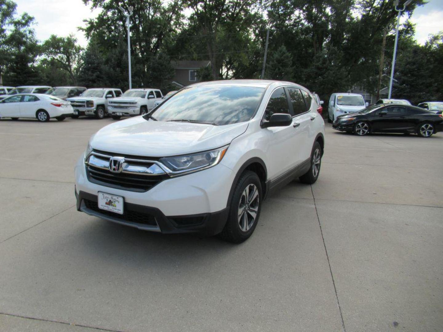 2018 WHITE HONDA CR-V LX (5J6RW6H34JL) with an 2.4L engine, Continuously Variable transmission, located at 908 SE 14th Street, Des Moines, IA, 50317, (515) 281-0330, 41.580303, -93.597046 - Photo#0