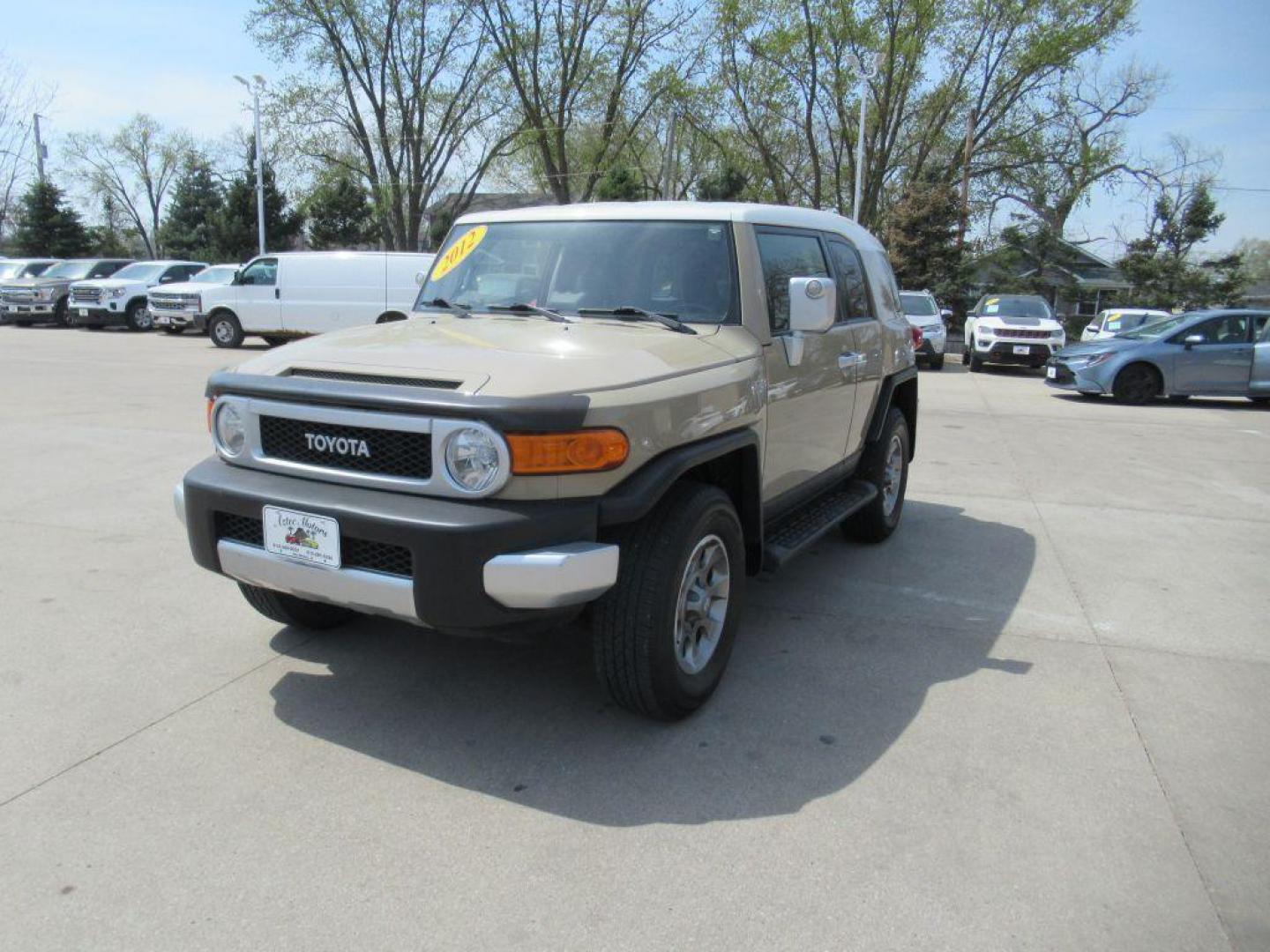 2012 GOLD TOYOTA FJ CRUISER (JTEBU4BF0CK) with an 4.0L engine, Automatic transmission, located at 908 SE 14th Street, Des Moines, IA, 50317, (515) 281-0330, 41.580303, -93.597046 - Photo#0
