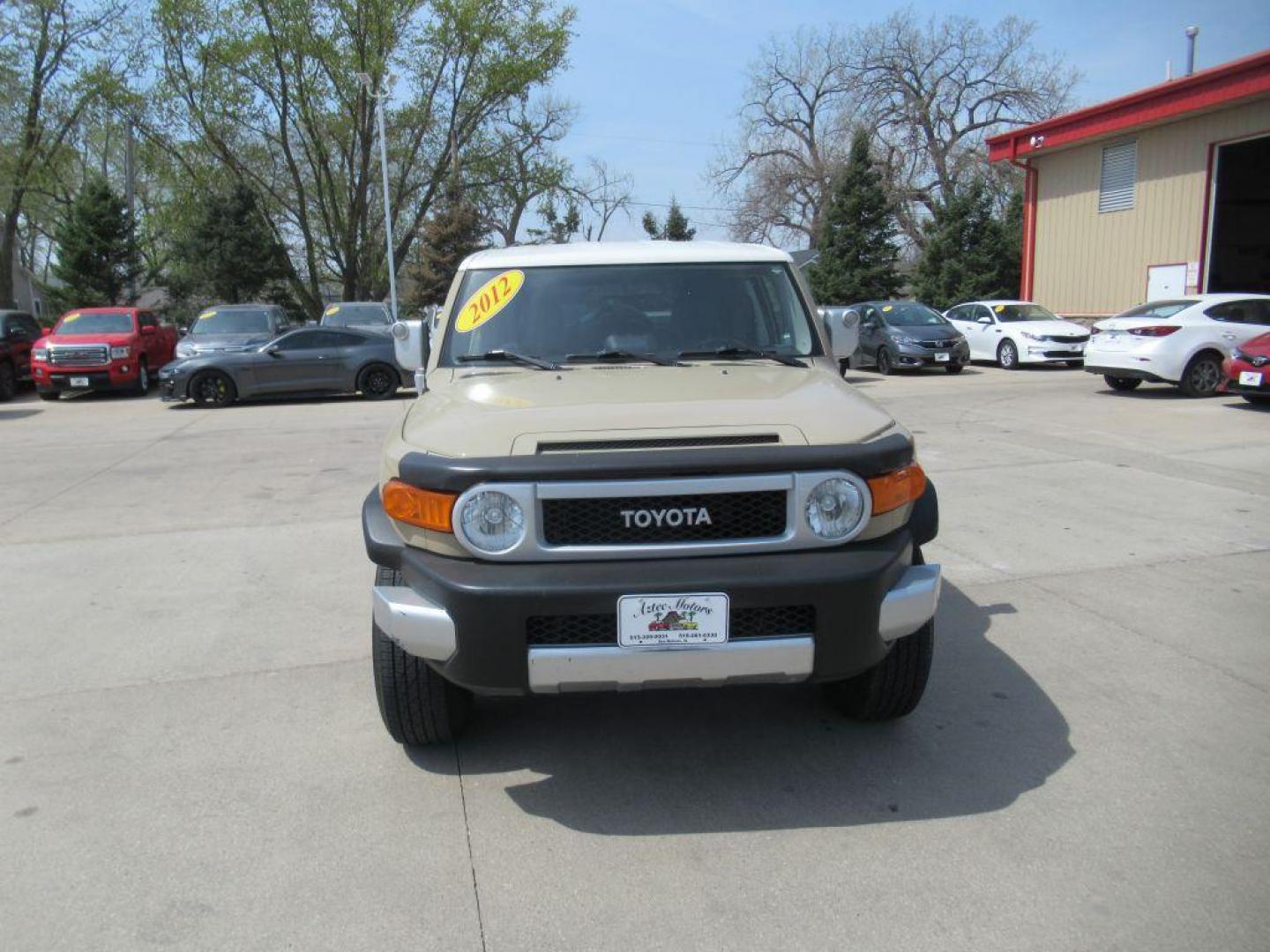 2012 GOLD TOYOTA FJ CRUISER (JTEBU4BF0CK) with an 4.0L engine, Automatic transmission, located at 908 SE 14th Street, Des Moines, IA, 50317, (515) 281-0330, 41.580303, -93.597046 - Photo#1