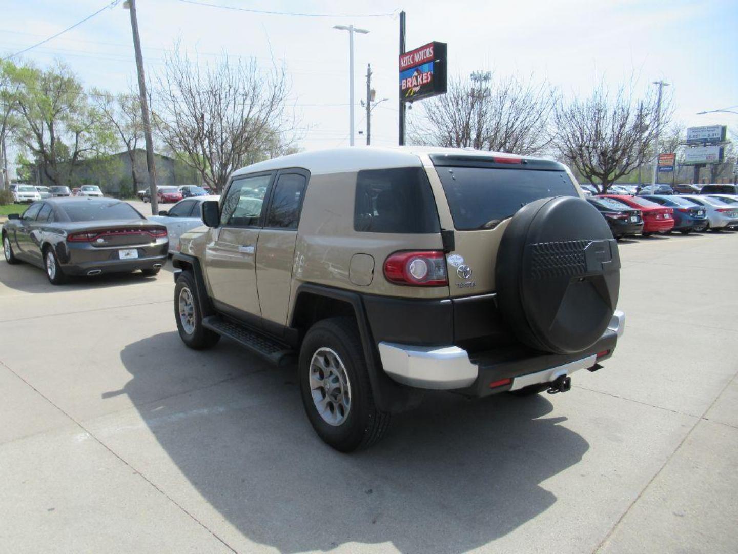 2012 GOLD TOYOTA FJ CRUISER (JTEBU4BF0CK) with an 4.0L engine, Automatic transmission, located at 908 SE 14th Street, Des Moines, IA, 50317, (515) 281-0330, 41.580303, -93.597046 - Photo#6