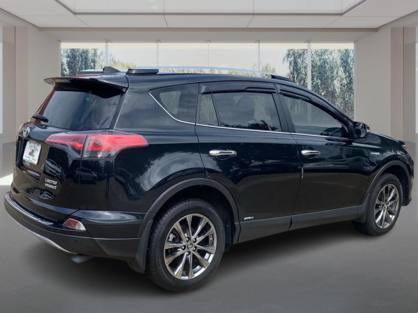2017 BLACK TOYOTA RAV4 HV LIMITED (JTMDJREV0HD) with an 2.5L engine, Continuously Variable transmission, located at 908 SE 14th Street, Des Moines, IA, 50317, (515) 281-0330, 41.580303, -93.597046 - Photo#2