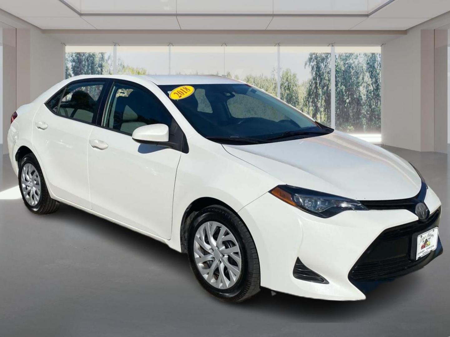 2018 WHITE TOYOTA COROLLA L (5YFBURHE5JP) with an 1.8L engine, Continuously Variable transmission, located at 908 SE 14th Street, Des Moines, IA, 50317, (515) 281-0330, 41.580303, -93.597046 - Photo#0