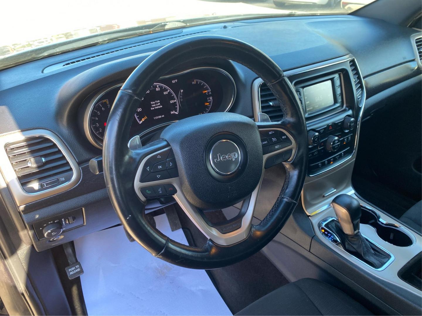 2016 BLACK JEEP GRAND CHEROKEE LAREDO (1C4RJFAG3GC) with an 3.6L engine, Automatic transmission, located at 908 SE 14th Street, Des Moines, IA, 50317, (515) 281-0330, 41.580303, -93.597046 - Photo#16