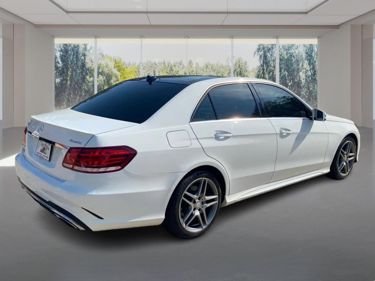 2015 WHITE MERCEDES-BENZ E-CLASS E400 4MATIC (WDDHF6HBXFB) with an 3.0L engine, Automatic transmission, located at 908 SE 14th Street, Des Moines, IA, 50317, (515) 281-0330, 41.580303, -93.597046- Photo#2
